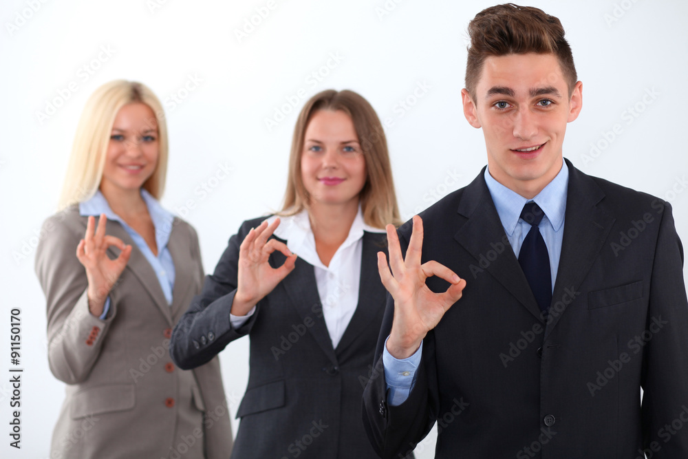 Group of business people, start-up team, ok hand sign Group of business people, start-up team, ok hand sign