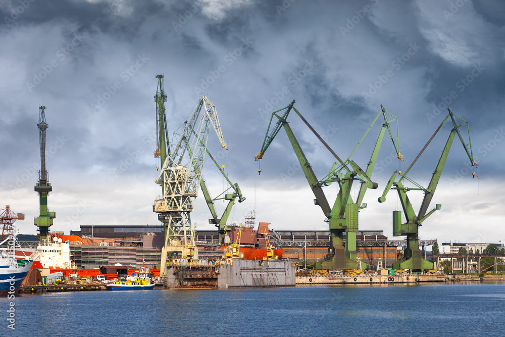 Big green cranes in shipyard of Gdansk, Poland.