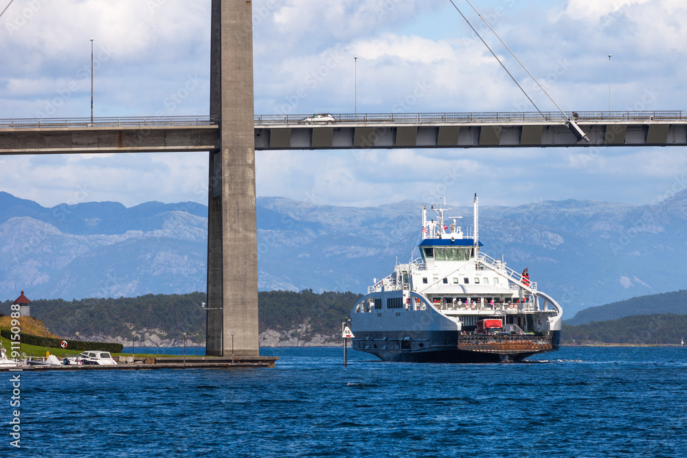 Car passenger ferry under bridge leaving port in Stavanger, Norway.