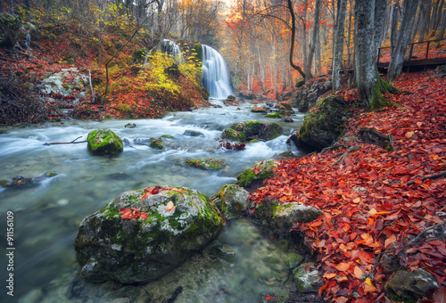 Beautiful waterfall in autu...