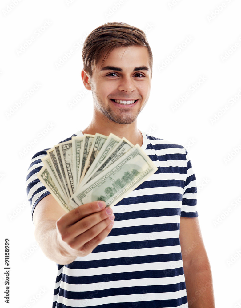 Handsome young man holding money isolated on white Handsome young man holding money isolated on white