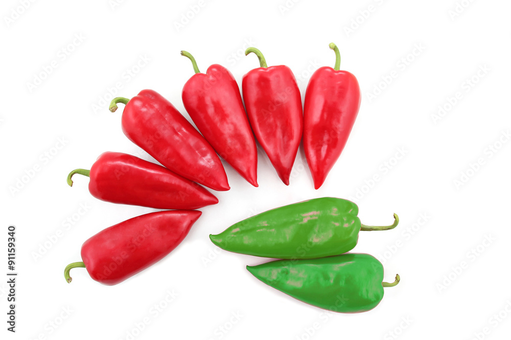 two bright green and six red sweet peppers on a white background two bright green and six red sweet peppers on a white background
