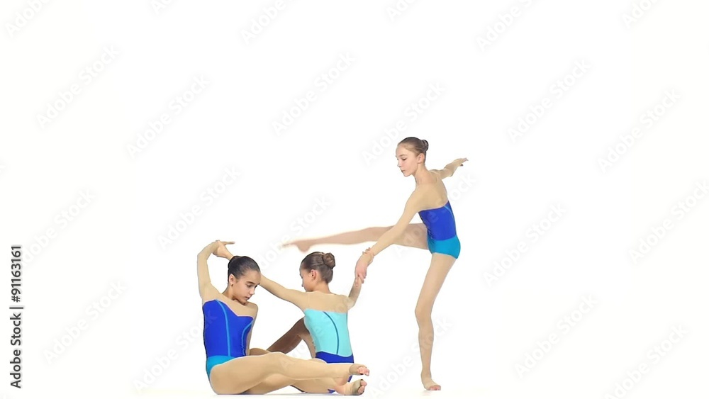 ballet girls posing in blue dress together on white, slow motion ballet girls posing in blue dress together on white, slow motion