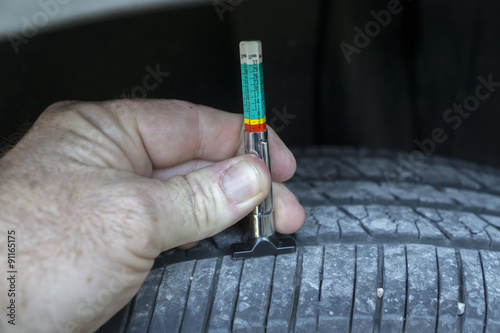 Measuring Tread Wear On A Car Tire