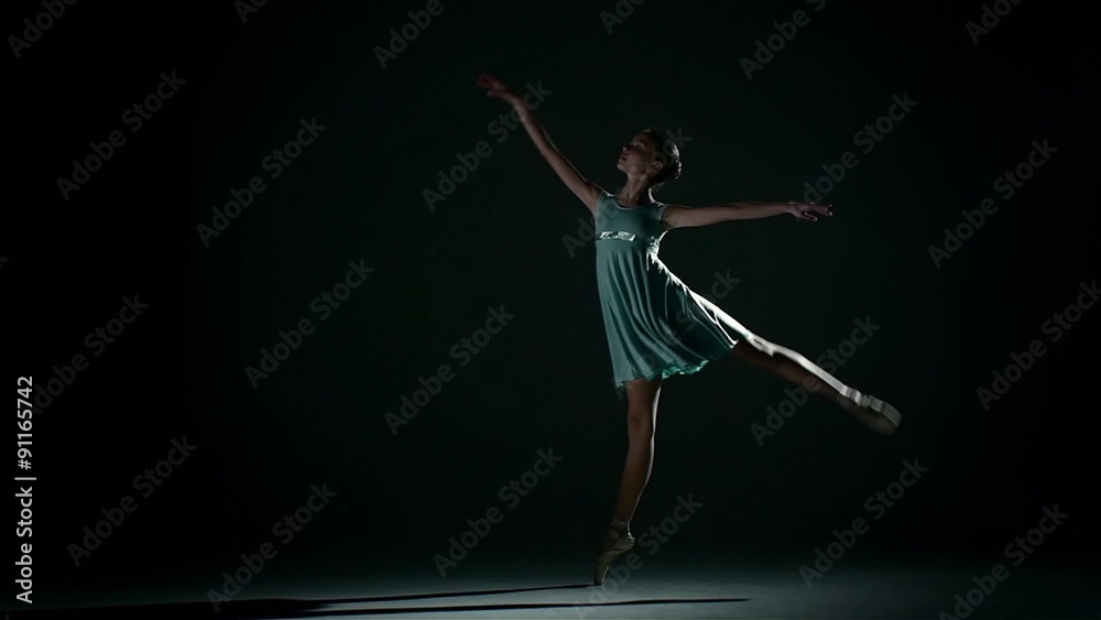 ballerinan in pretty blue dress on a dark background ballerinan in pretty blue dress on a dark background