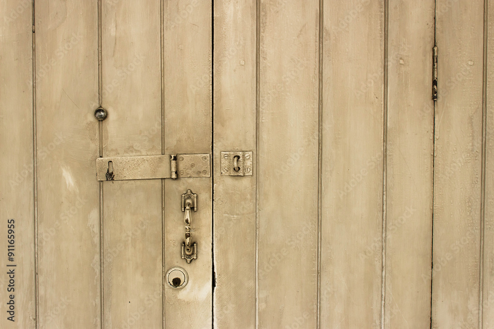 old wooden door with lock, handle, and eye hole. old wooden door with lock, handle, and eye hole.