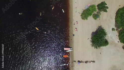 People enjoying a beach in Amazon, Manaus, Brazil photo