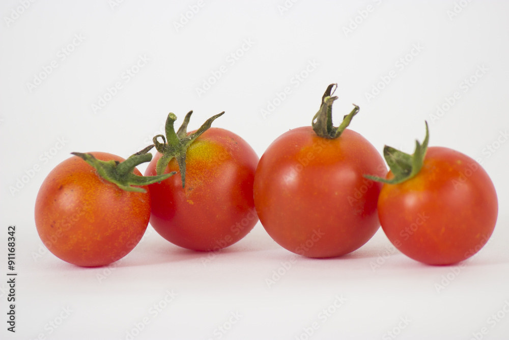 Red tomatoes on white