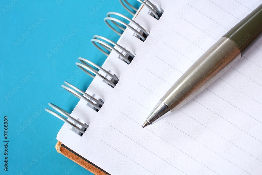 Blank notepad with pen on office table Blank notepad with pen on office table
