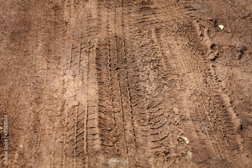 Texture of wheel track on country road © Piman Khrutmuang