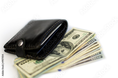 Black wallet with dollars 
