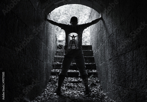 Infinity inner world concept, young man in tunnel