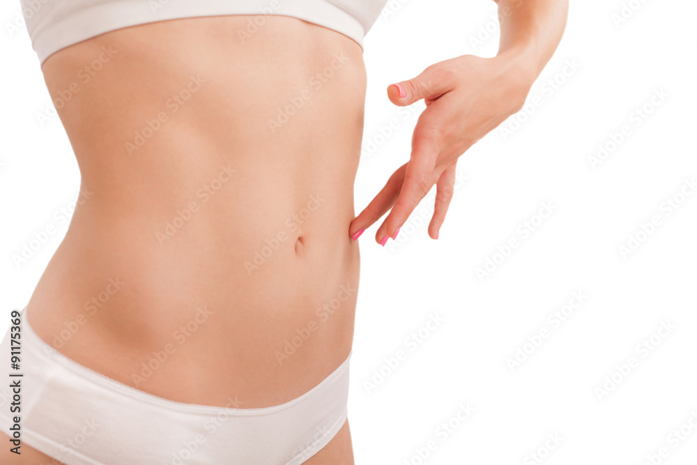 Flat tummy girl on white. Photos Adobe Stock