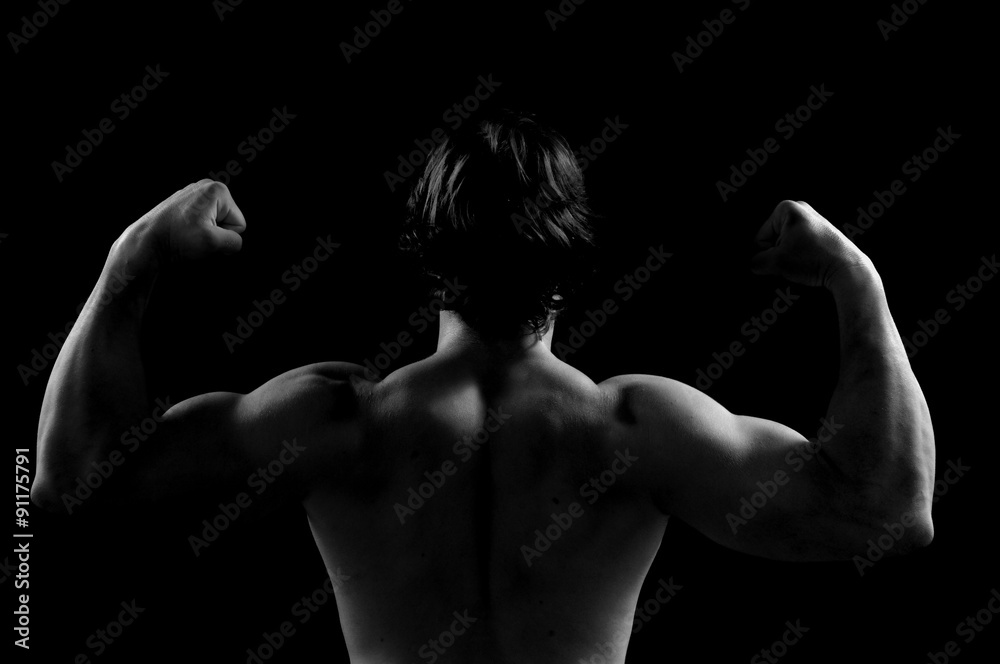 silhouette of a man doing strength sword black background