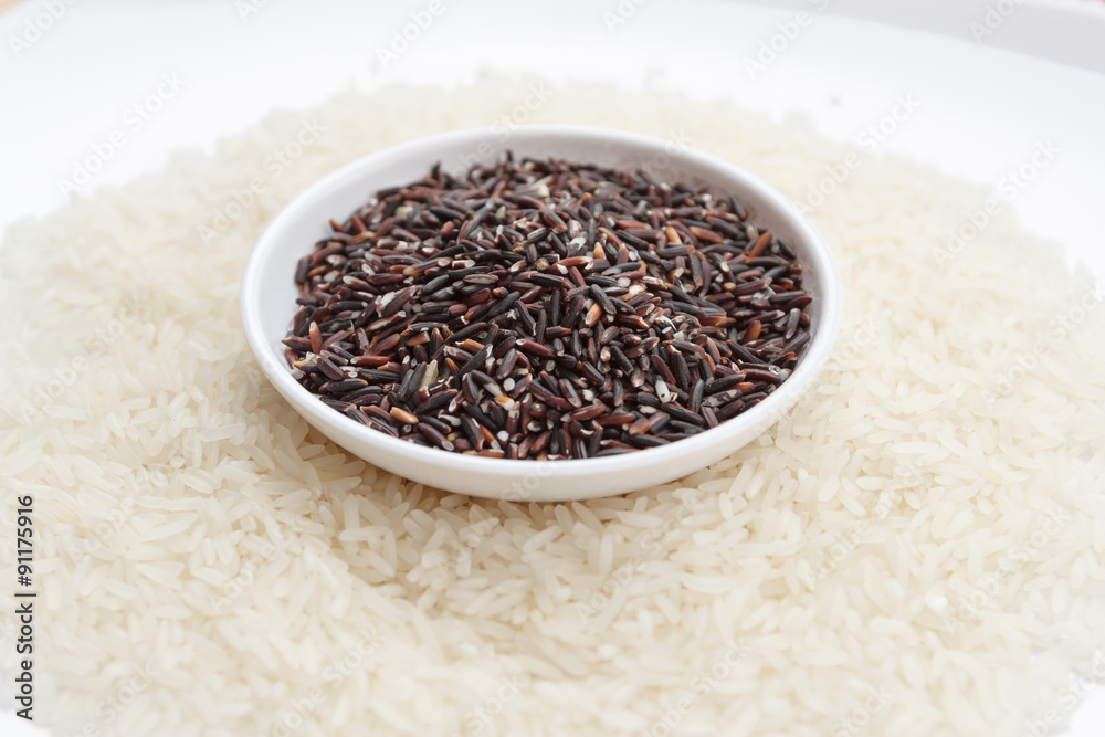 Mixture of dark brown and white rice on two white plates, horizontal view Mixture of dark brown and white rice on two white plates, horizontal view