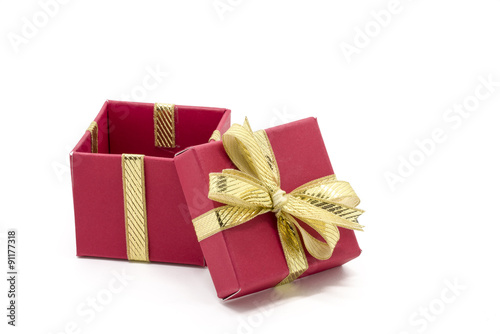 christmas gift box with a gold ribbon bow © pixs4u