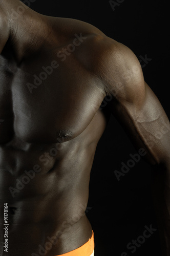 A black man with a muscular body,