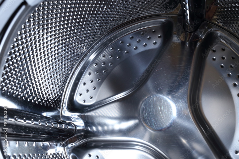 closeup image of washing machine, abstract metallic texture closeup image of washing machine, abstract metallic texture