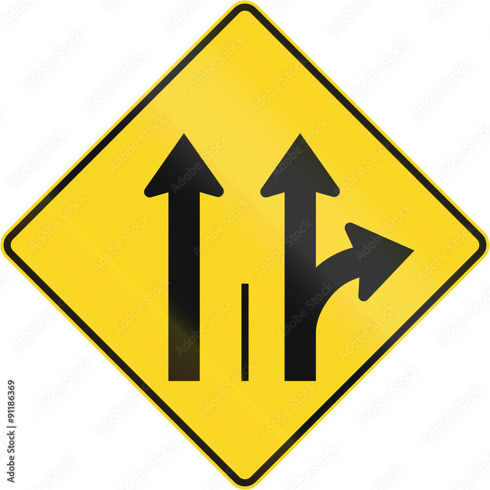 Warning road sign in Quebec, Canada - Two lanes with straight and turn lane Warning road sign in Quebec, Canada - Two lanes with straight and turn lane