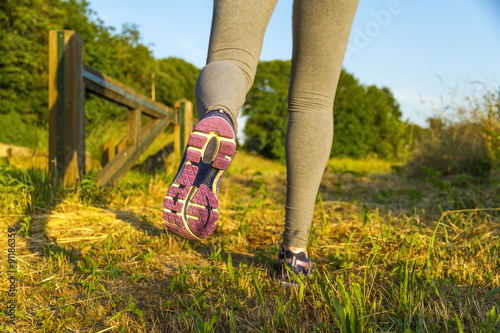 Woman running in a field