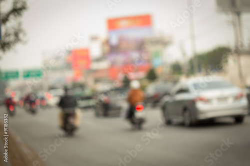 car and motorcycle driving on road with traffic jam in the city © sutichak