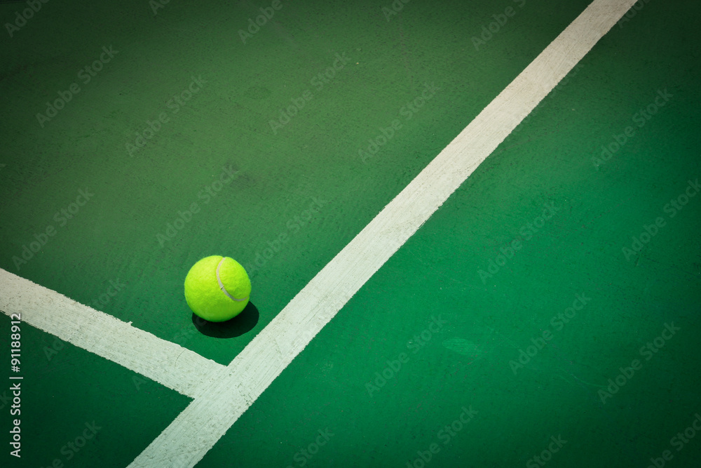 tennis ball on green court