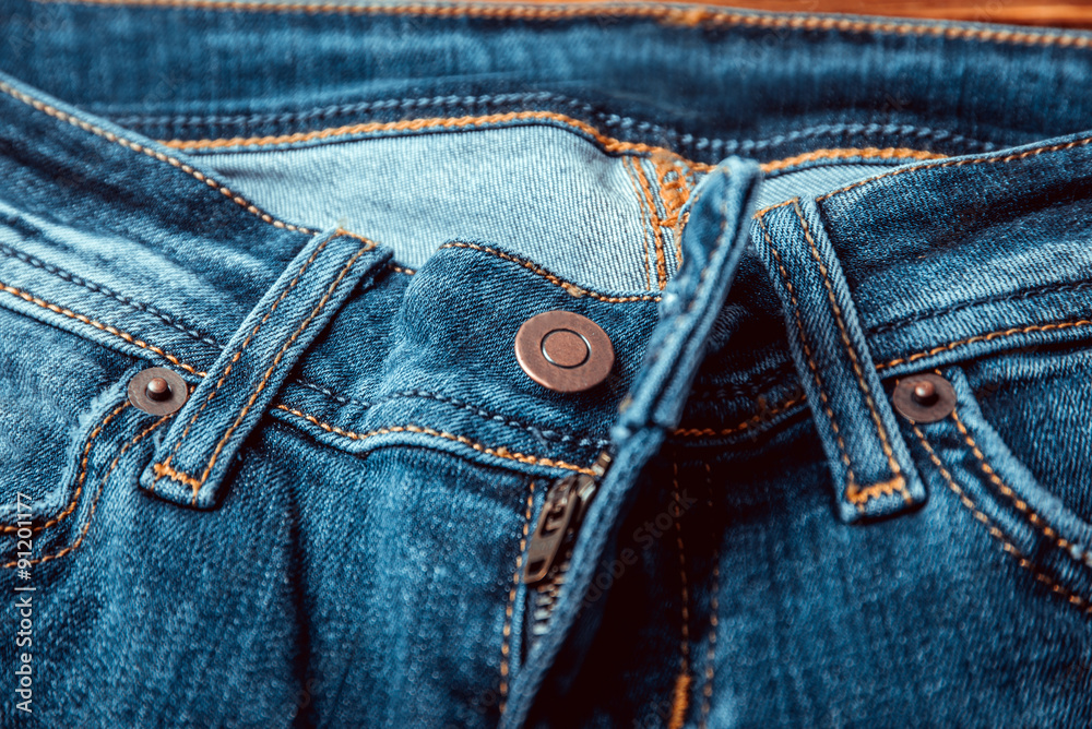 Opened light blue denim jeans fly