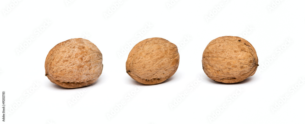 three walnuts close up isolated on white background three walnuts close up isolated on white background