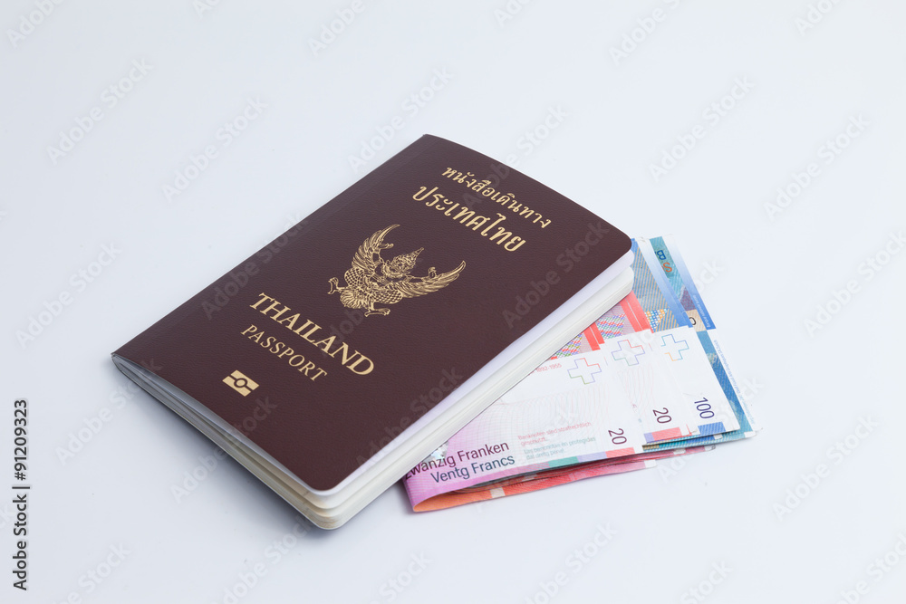 Thai passport with switzerland currency. Thai passport with switzerland currency.