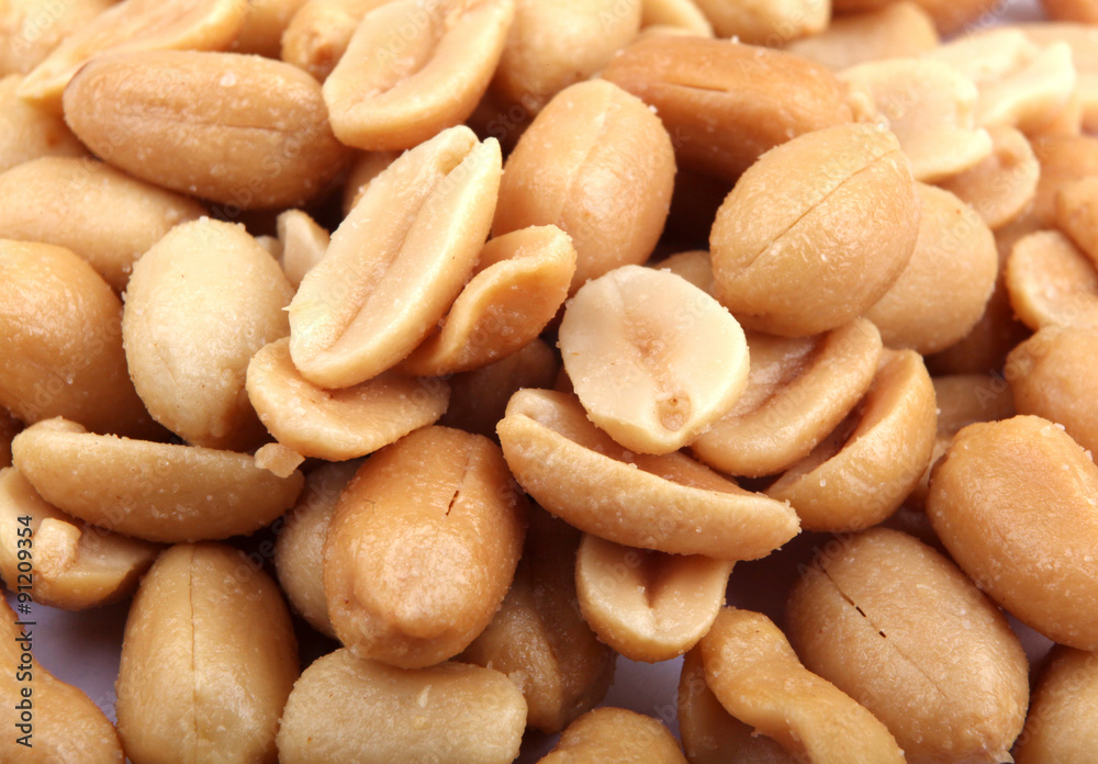 Close up of fried, peeled and salted peanuts. Close up of fried, peeled and salted peanuts.