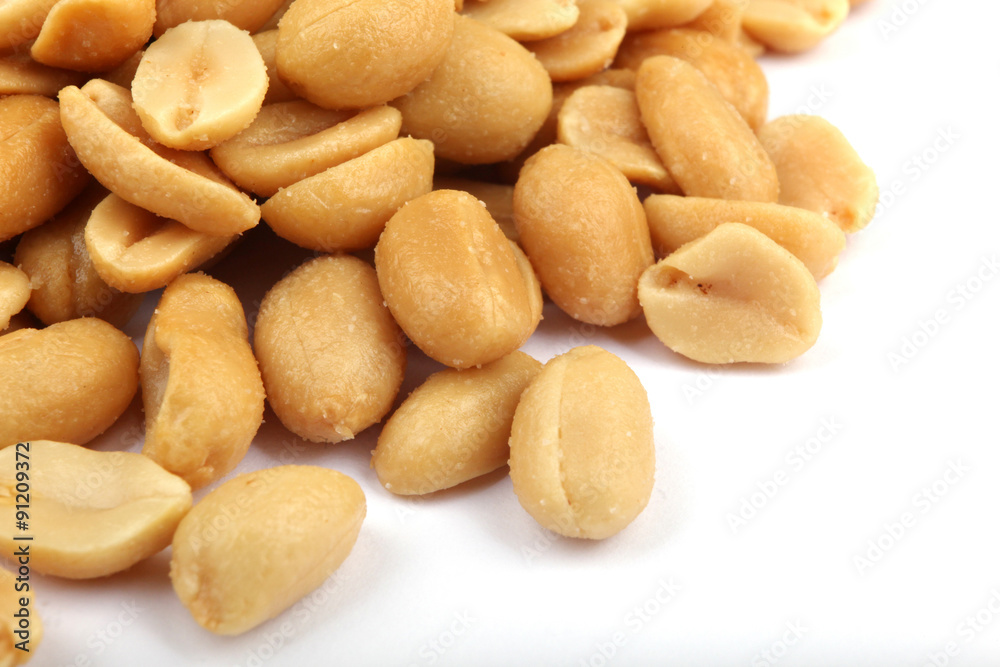 Close up of fried, peeled and salted peanuts. Close up of fried, peeled and salted peanuts.