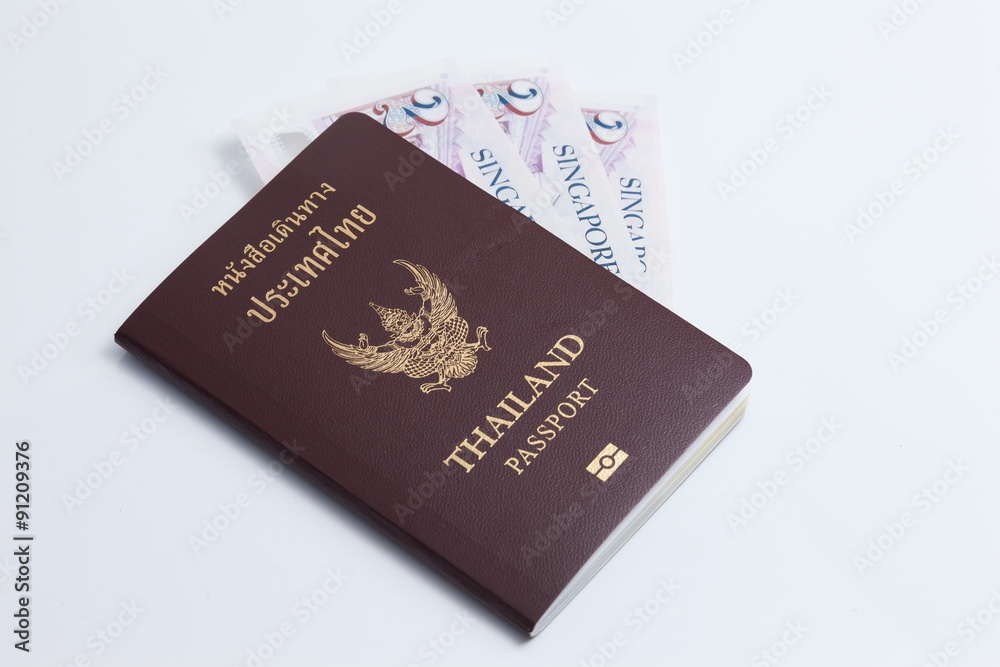 Thai passport with singapore currency Thai passport with singapore currency