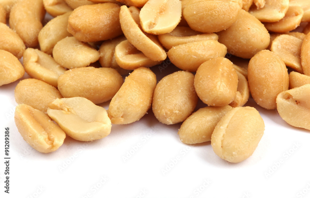 Close up of fried, peeled and salted peanuts. Close up of fried, peeled and salted peanuts.