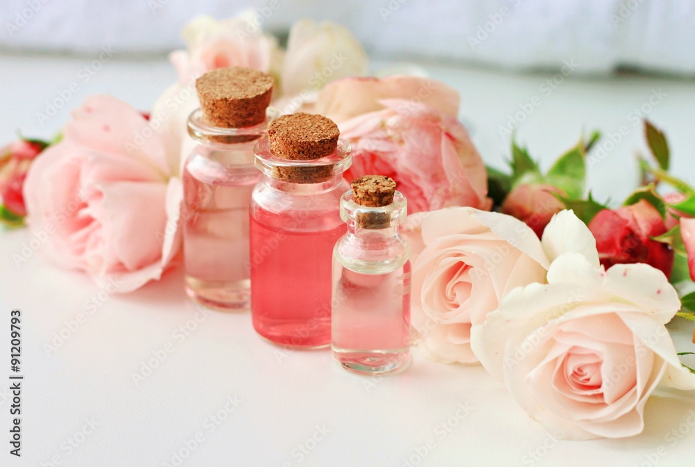 Rose spa setting aromatic water in bottles natural freshness soft delicate flowers feminine beauty Rose spa setting aromatic water in bottles natural freshness soft delicate flowers feminine beauty