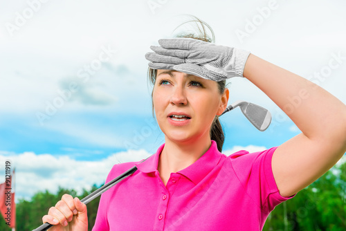 golfer looks into the ball flying high