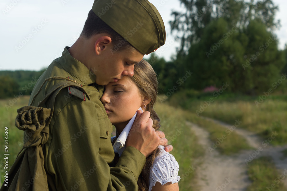 Soviet soldier saying goodbye to girl