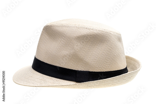 Panama straw hat with black ribbon seen from left on white background
