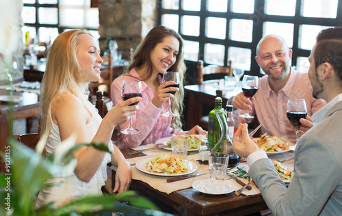 Young people enjoying food at tavern