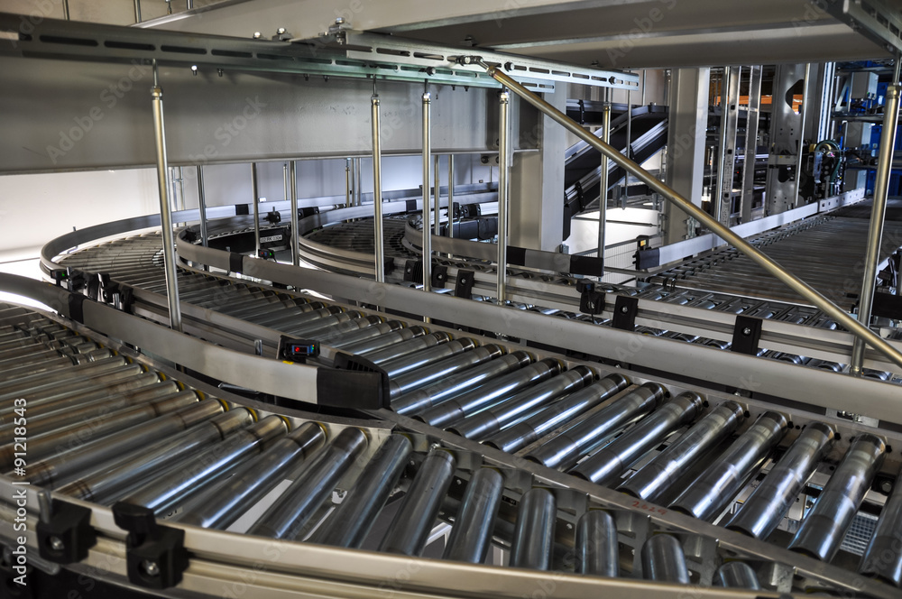 Close up shot of two roller conveyors in an automated warehouse.