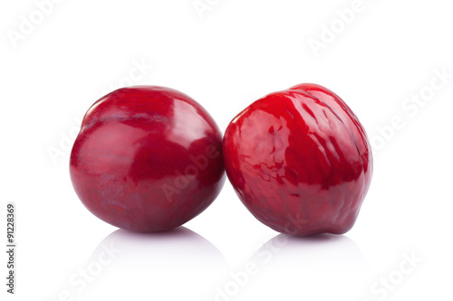 plums isolated on white