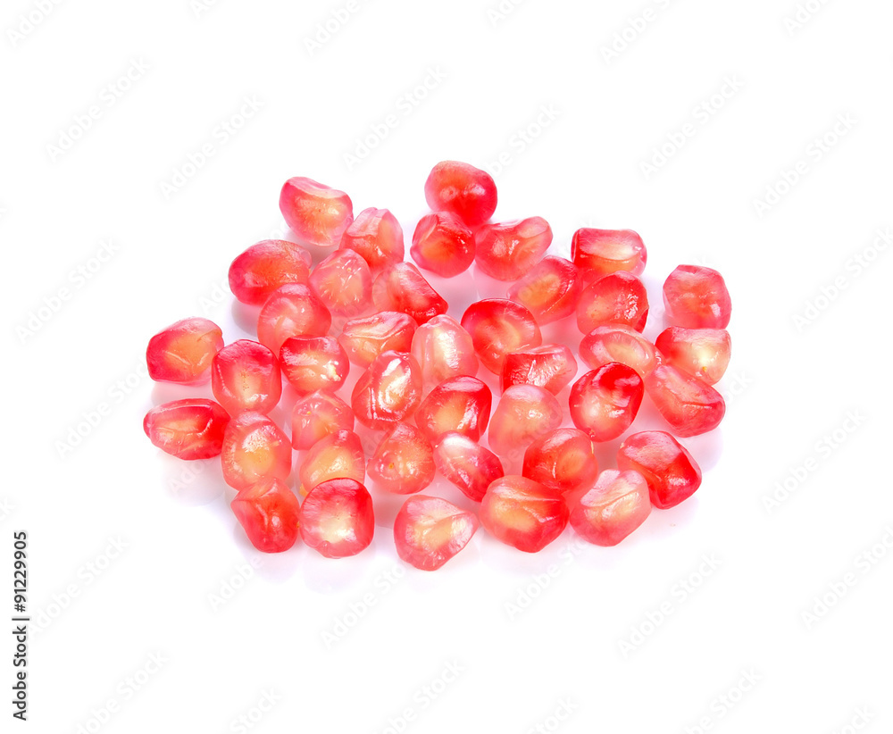 Pomegranate seeds on a white background. Pomegranate seeds on a white background.