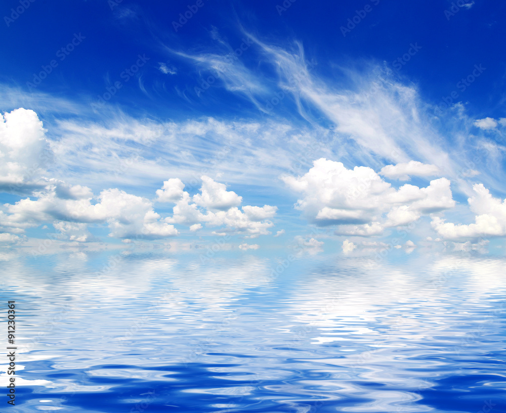 white fluffy clouds with rainbow in the blue sky white fluffy clouds with rainbow in the blue sky