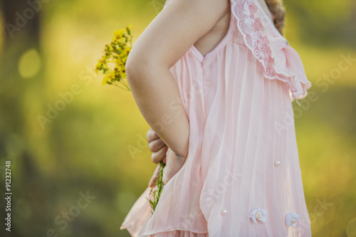 Girl with yellow flowers