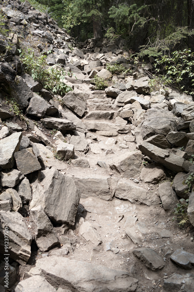Steep Rocky Trail. Hiking to the top of the rocky Mountains Steep Rocky Trail. Hiking to the top of the rocky Mountains