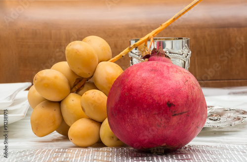 Palm and pomegranate. simanim-Traditional food for Rosh Hashanah  (In Hebrew tamr and rimon) photo