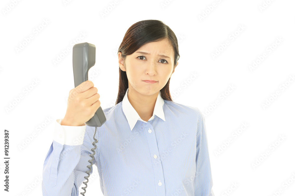 受話器を持つ女性 受話器を持つ女性