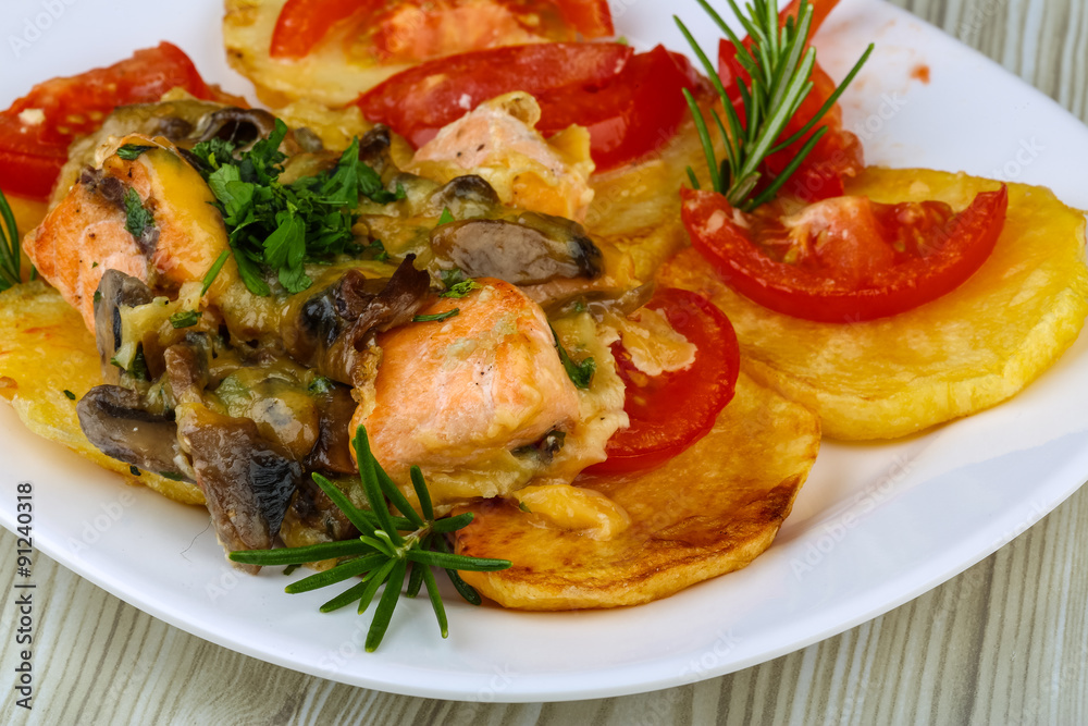 Roasted salmon with potato and tomato