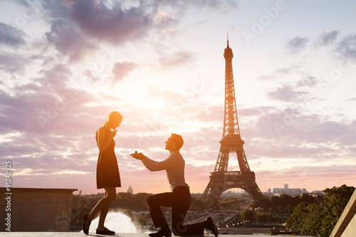 Romantic marriage proposal at Eiffel Tower, Paris, France photo