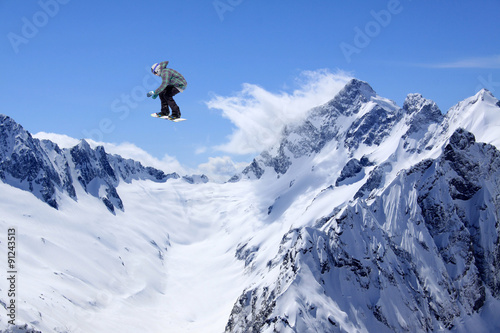 Flying snowboarder on mountains © Vasily Merkushev