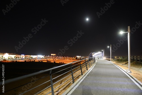 Night pedestrian bridge over the highway in Orihuela Costa